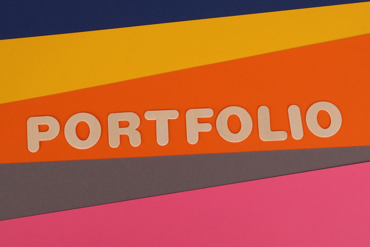 services-03 A vibrant multicolored background featuring the text PORTFOLIO in pink font on colorful paper.